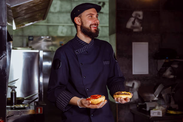 istock Chef putting bun on top,he making a beef burger for customer order 1065819688