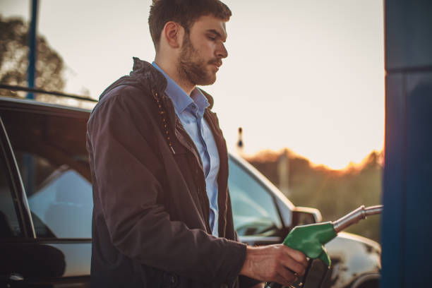 istock Young man at the gas station 1065821748
