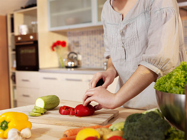 istock Young woman chopping food 106582183