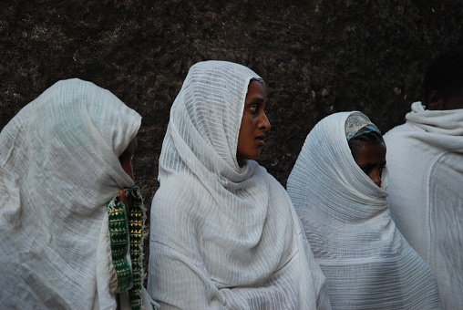 Lalibela, Ethiopia, 4th February 2007: Group of pilgrims attend religious ceremony outside of rock hewn church