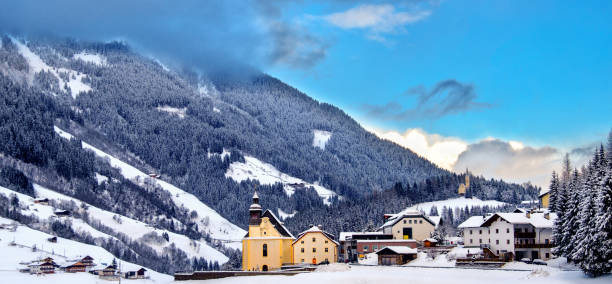 panoramic overview church snowy valley beautiful winter sunny day trentino alto adige italy - bressanone imagens e fotografias de stock