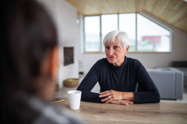 istock Mother And Daughter Having Small Talk Over Coffee 1065831556