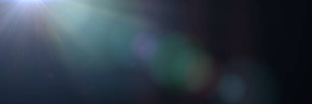 istock bright and mainly off screen lens flare effect overlay banner texture with bokeh and lens distortion effects in front of a black background 1065832346