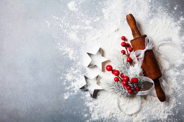 istock Bakery background for cooking christmas baking with rolling pin and flour decorated with fir tree top view. 1065832490