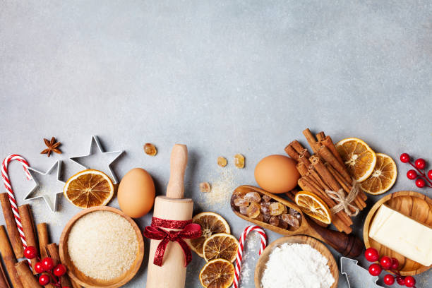 istock Bakery background with ingredients for cooking christmas baking decorated with fir tree. Flour, brown sugar, eggs and spices top view. 1065832516