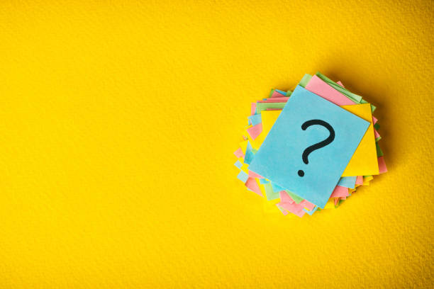 question marks written reminders tickets on yellow vintage paper background question marks written reminders tickets on yellow vintage paper background. frequently asked questions stock pictures, royalty-free photos & images