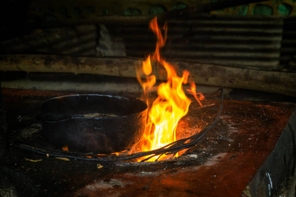 istock Open cooking place with fire and a kettle for deep frying 1065835830
