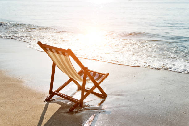 istock Wooden deck chairs on the beach 1065837800