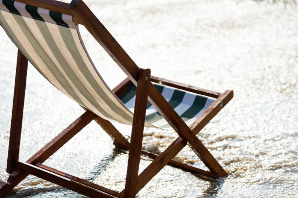 Wooden deck chairs on the beach.