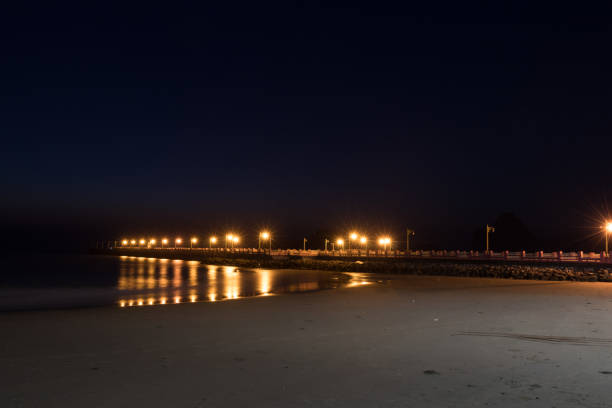istock The lights on the jetty at night 1065838214