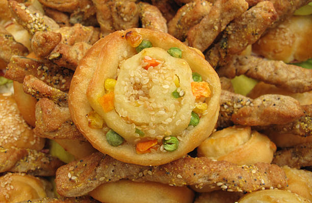 Baked dough with cheese, sesame and vegetables