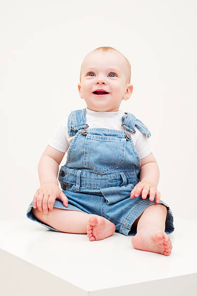 istock happy baby in dungarees 106584642