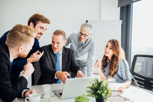 istock Business people using laptop and talking 1065848988