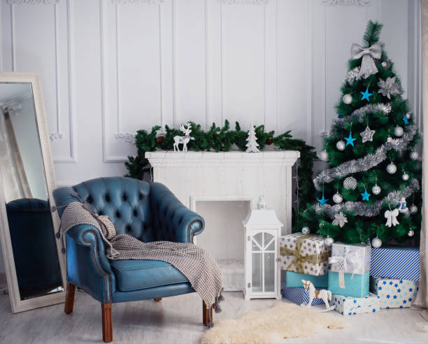 istock Room with a Christmas tree and fireplace 1065852114