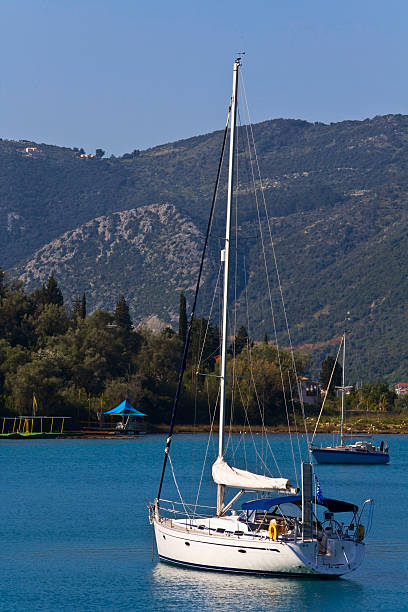 Sailing boats anchored near the shore of Anti-paxos island, Greece