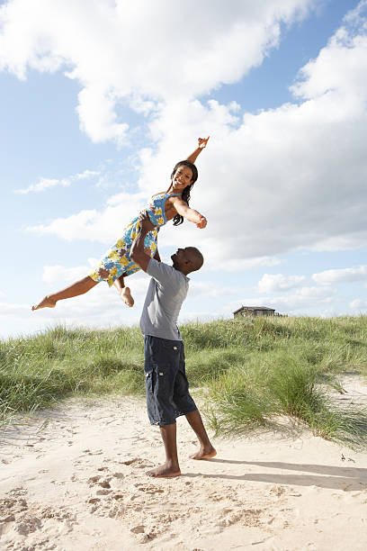 istock Energetic Young Couple Having Fun In Dunes By Beach 106586034