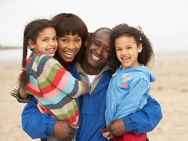 istock Family Relaxing On Winter Beach Break 106586146