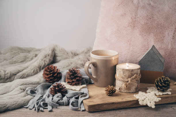 istock Hygge Scandinavian style concept with coffee cup, candles and pine corn 1065865328