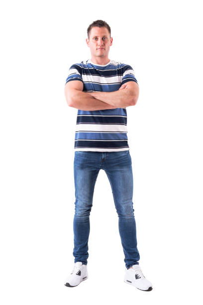 istock Serious successful man with blank facial expression looking at camera with crossed arms 1065865664