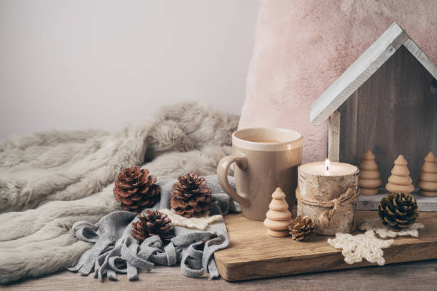 istock Hygge Scandinavian style concept with coffee cup, candles and pine corn 1065865976