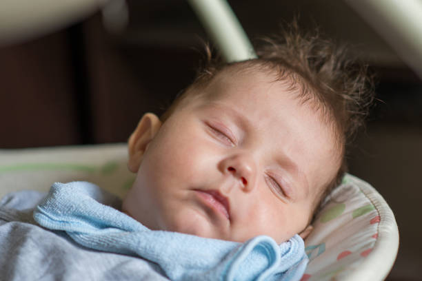 A cute newborn baby sleeps, rests