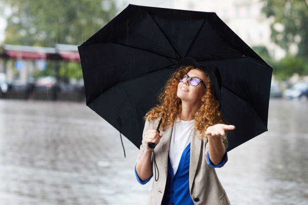 istock Girl with umbrella 1065872068