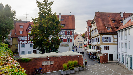 Glimpse of the old town of Ulm, a city on the banks of the River Danube in the federal state of Baden-Württemberg. The city is rich in beautiful historic buildings from the late Middle Ages / renaissance. People.