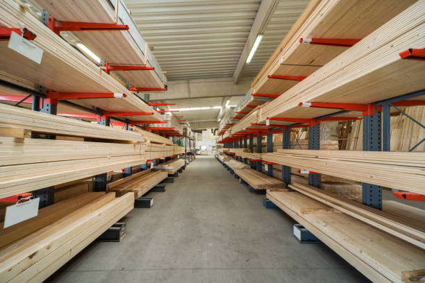 istock Racks with stacked wooden planks in warehouse 1065874096