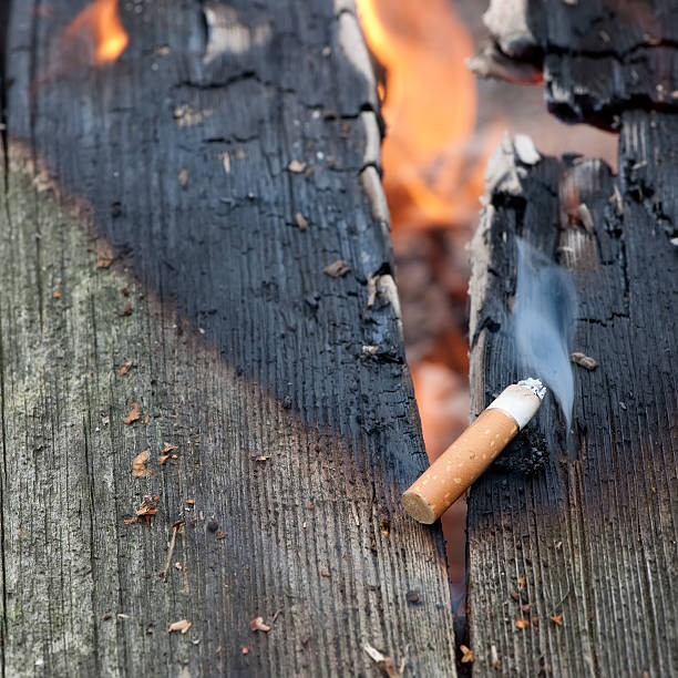 No smoking The effect of smoking - house fire. cigarette fire stock pictures, royalty-free photos & images