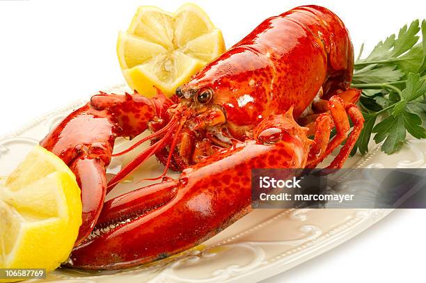 A Lobster With Lemon Ready To Eat Stock Photo - Download Image Now - Animal, Boiled, Claw