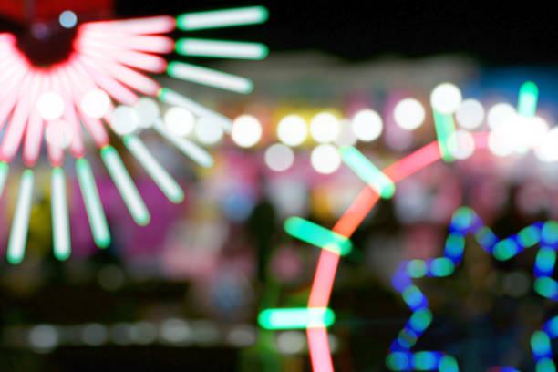 istock Defocused and blurred image of people at amusement park 1065877756