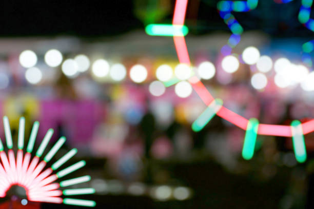istock Defocused and blurred image of people at amusement park 1065877780