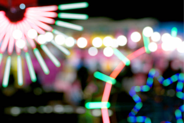 istock Defocused and blurred image of people at amusement park 1065878902