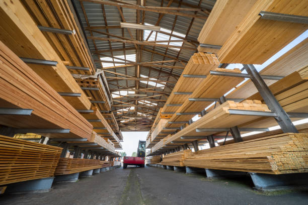 istock Racks with stacked wooden planks in warehouse 1065878974