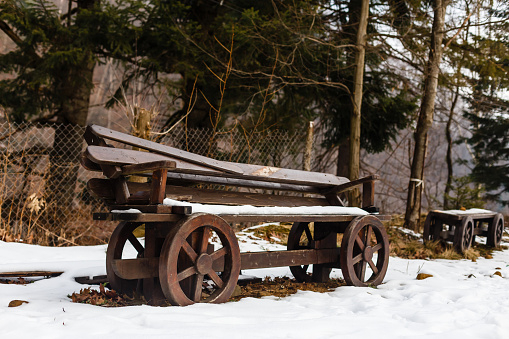 Wooden garden bench stylized to resemble an old cart