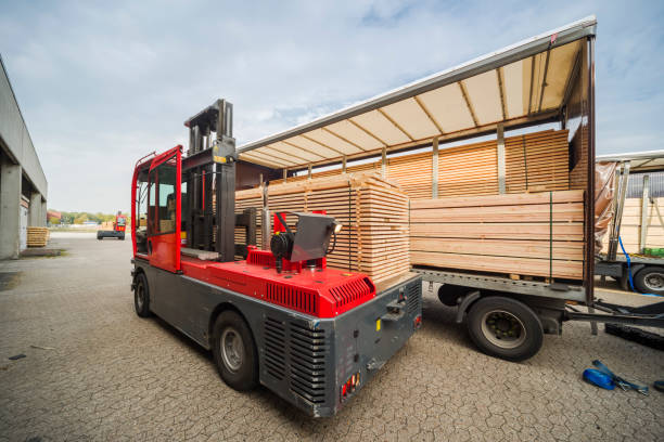 istock Forklift loading wood on semi-truck trailer 1065881576