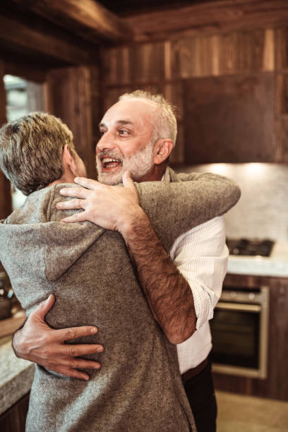 istock senior adult embracing at home 1065881700