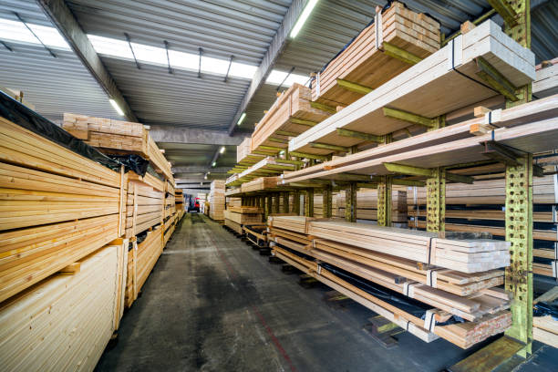 istock Racks with stacked wooden planks in warehouse 1065881914