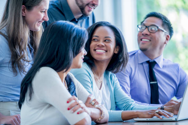istock Colleagues smile at each other 1065883628