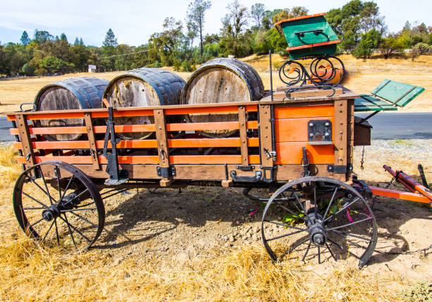 istock Old Wine Barrels In Vintage Wooden Wagon 1065887826