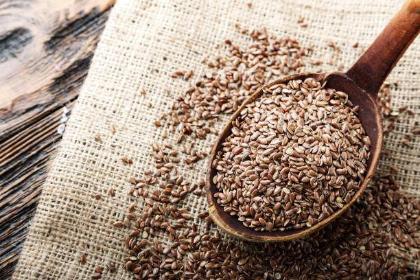 istock wooden spoon with flax seed placed 1065888944