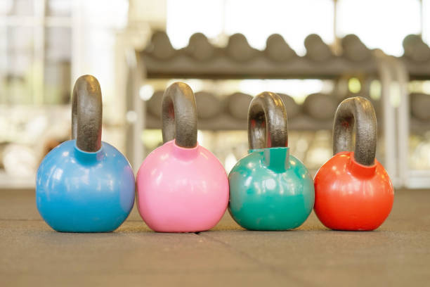 istock Colorful kettlebells in gym 1065899330