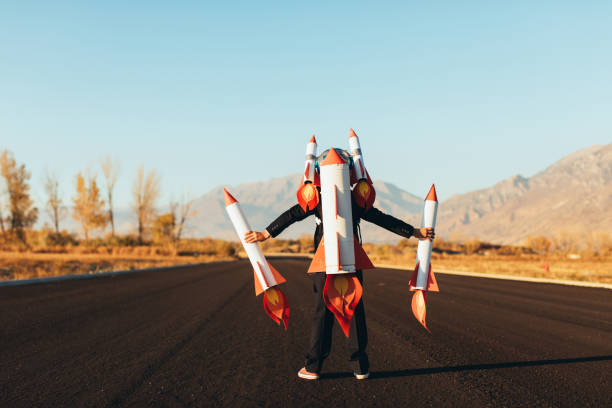 istock Business Boy Holding Rockets 1065901710