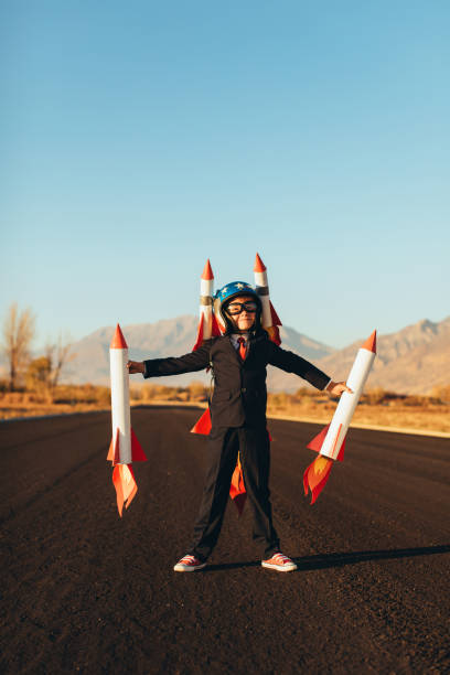 istock Business Boy Holding Rockets 1065901738