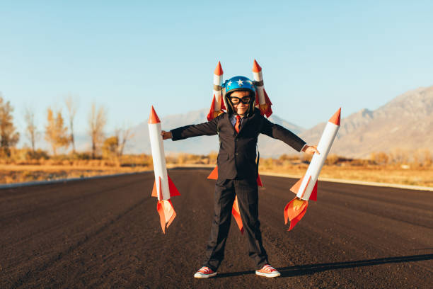 istock Business Boy Holding Rockets 1065901746