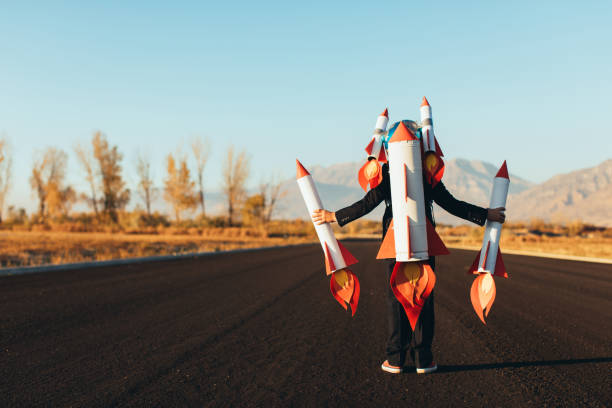 istock Business Boy Holding Rockets 1065901788