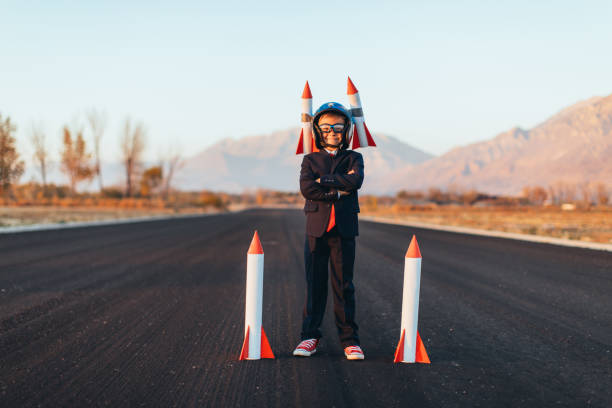 istock Business Boy Holding Rockets 1065901990