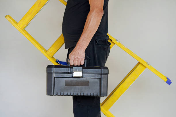 istock worker with wooden ladder 1065902220