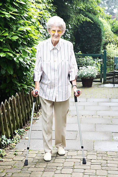 istock senior woman with crutches 106590257