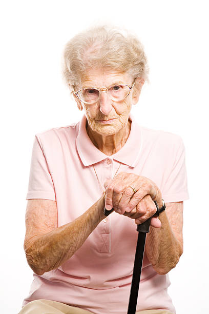 istock senior woman with her walking stick 106590303